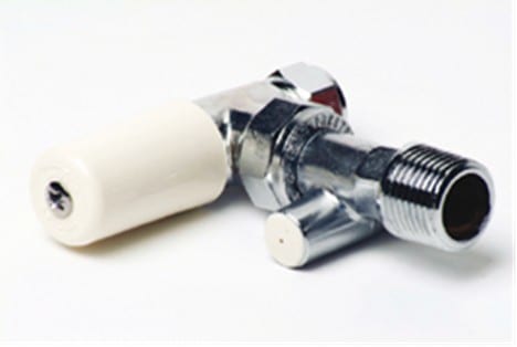Lockshield radiator valve with plastic cap, used for balancing flow on the return side of a radiator